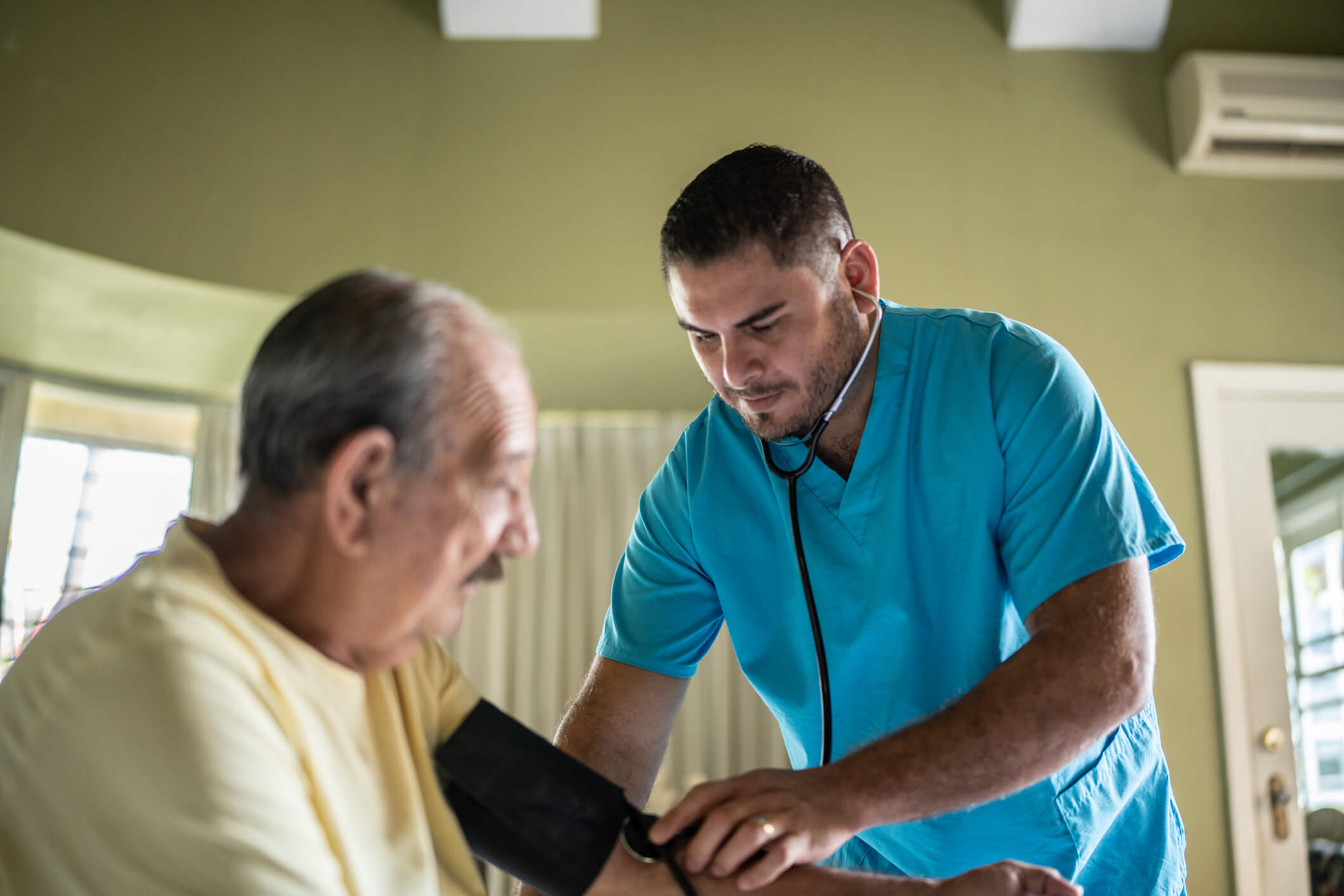 male nurse taking blood pressure